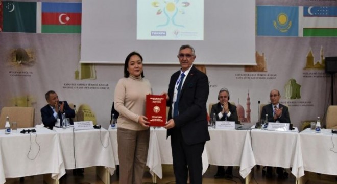 Manas'ın Dadaş Rektörüne şeref belgesi